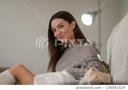 Smiling young woman looking happy and joyful 136991824