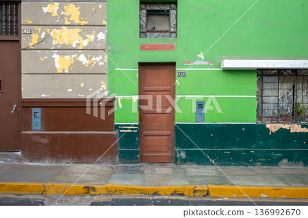 Green wall with windows and door in Lima, Peru Green wall with windows and door in Lima, Peru 136992670
