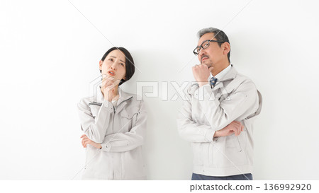Men and women in work clothes 136992920