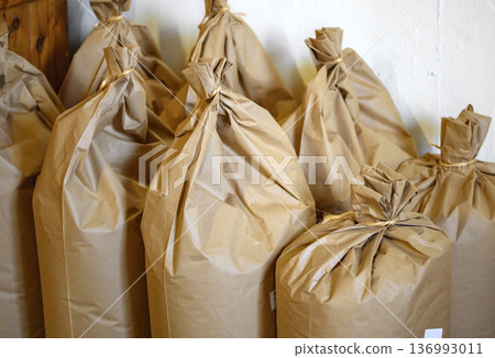 paper bags filled with wheat meal paper bags filled with wheat meal 136993011