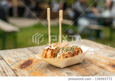 Takoyaki - traditional Japanese street food, outdoor snack with octopus Takoyaki fried balls Takoyaki - traditional Japanese street food, outdoor snack with octopus Takoyaki fried balls 136993772