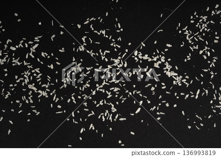 Grated coconut powder. Dry coco flakes pile, shredded desiccated coconut, tropical fruit chips 136993819