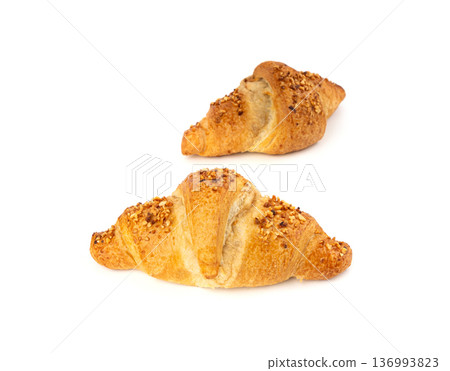 Delicious croissant with nut crumbs, sweet French bakery 136993823