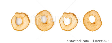 Dry apple slices isolated, dried apple chips, healthy fruit snack Dry apple slices isolated, dried apple chips, healthy fruit snack 136993828
