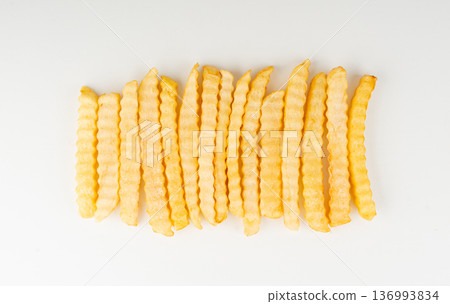 Frozen potato sticks isolated, iced finger chips 136993834