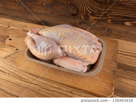 Helmeted guinea fowl raw meat 136993838