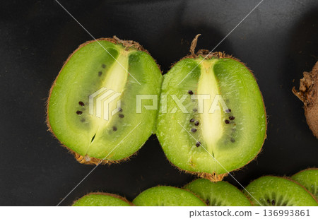 Kiwi fruit pattern, green kiwifruit slice texture Kiwi fruit pattern, green kiwifruit slice texture 136993861