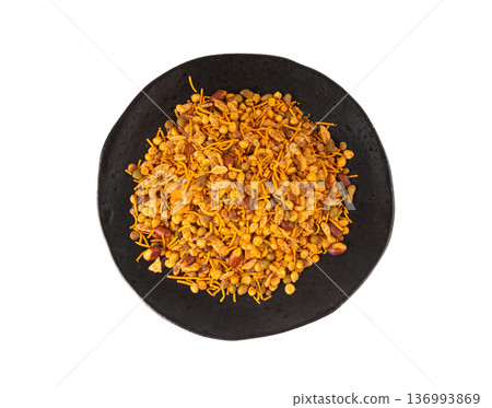 Navrattan namkeen mixture. Indian nimko snack, spicy and sweet farsaan Navrattan namkeen mixture. Indian nimko snack, spicy and sweet farsaan 136993869