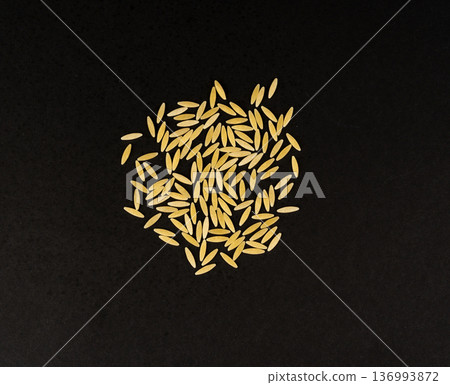 Raw orzo pasta, risoni or kritharaki pile 136993872
