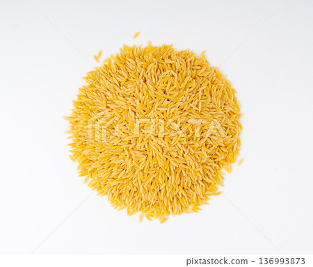 Raw orzo pasta, risoni or kritharaki pile 136993873