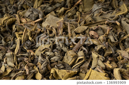 Green tea leaves macro textured background Green tea leaves macro textured background 136993909