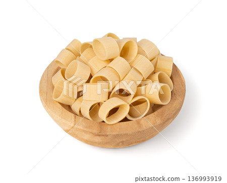 Raw Calamarata Big Pasta Isolated, Homemade Dry Macaroni, Italian Raw Round Noodle 136993919