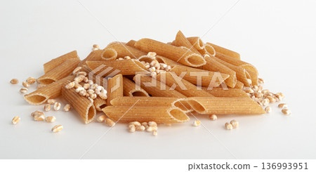 Raw Brown Pasta, Wholegrain Penne, Dry Whole Grain Noodle, Raw Spelt Macaroni, Healthy Italy Food Raw Brown Pasta, Wholegrain Penne, Dry Whole Grain Noodle, Raw Spelt Macaroni, Healthy Italy Food 136993951