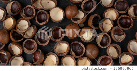 Macadamia nuts pattern. Natural raw peeled macadamia seeds and shells 136993965