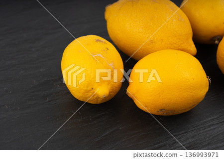 Old dried lemons. Fruits with darkened skins 136993971