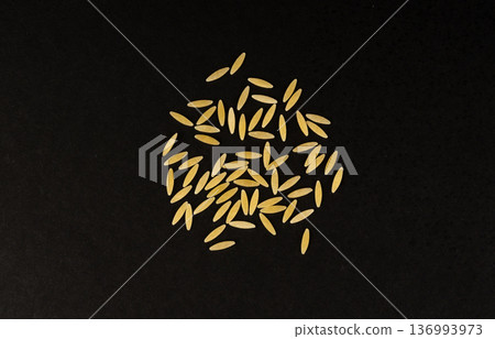 Raw orzo pasta, risoni or kritharaki pile 136993973