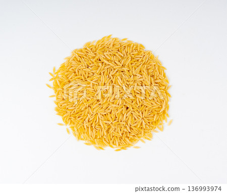 Raw orzo pasta, risoni or kritharaki pile 136993974