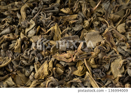 Green tea leaves macro textured background Green tea leaves macro textured background 136994009