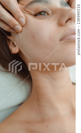 Professional aesthetician performs precise pore extraction techniques Professional aesthetician performs precise pore extraction techniques 136994318