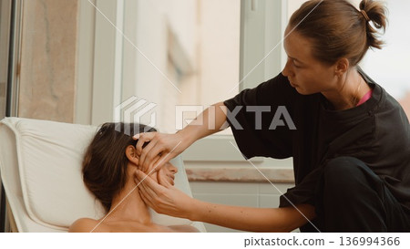 Gentle pressure and movement alleviate facial muscle tightness effectively 136994366