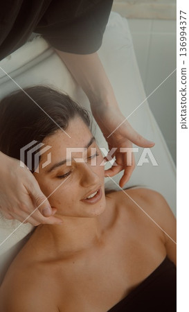 Method showing peaceful muscle relaxation in woman lying down Method showing peaceful muscle relaxation in woman lying down 136994377
