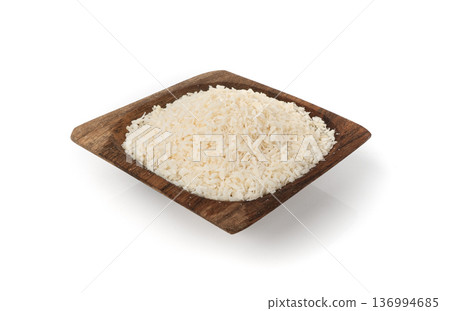 Grated coconut powder. Dry coco flakes pile, shredded desiccated coconut, tropical fruit chips Grated coconut powder. Dry coco flakes pile, shredded desiccated coconut, tropical fruit chips 136994685