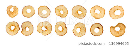 Dry apple slices isolated, dried apple chips, healthy fruit snack Dry apple slices isolated, dried apple chips, healthy fruit snack 136994695