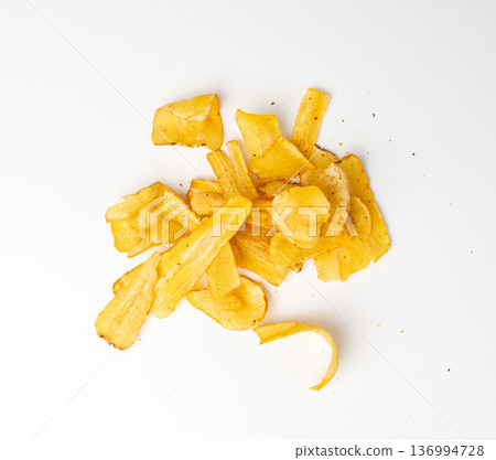 Dry parsnip chips isolated, dried sliced vegetable, healthy crispy Pastinaca sativa snack pile Dry parsnip chips isolated, dried sliced vegetable, healthy crispy Pastinaca sativa snack pile 136994728