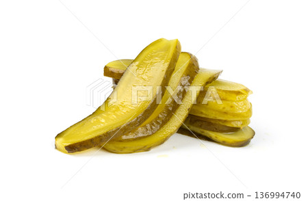 Pickled sliced cucumbers, fermented food, marinated canned vegetables, gherkins, pickles 136994740