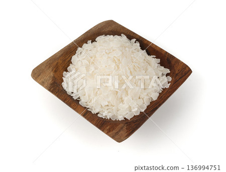 Raw flattened rice isolated. Dry rice flakes or poha, Indian breakfast food Raw flattened rice isolated. Dry rice flakes or poha, Indian breakfast food 136994751