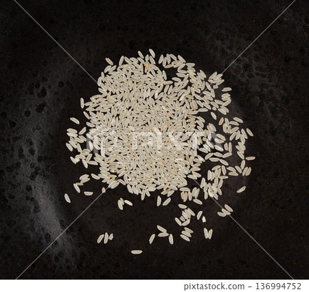 White parboiled rice grains. Dry uncooked ponni rice, small organic basmati White parboiled rice grains. Dry uncooked ponni rice, small organic basmati 136994752