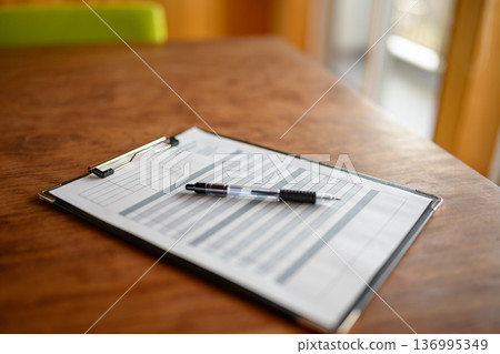 Documents and pen on a desk Documents and pen on a desk 136995349