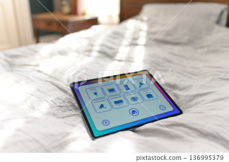 Smart home tablet on bed 136995379