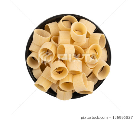 Raw Calamarata Big Pasta Isolated, Homemade Dry Macaroni, Italian Raw Round Noodle 136995827