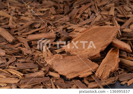 Broken ceylon cinnamon macro texture, cinnamomum verum bark pieces pattern Broken ceylon cinnamon macro texture, cinnamomum verum bark pieces pattern 136995837