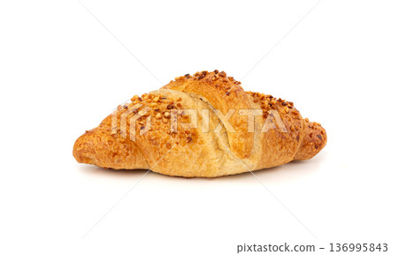 Delicious croissant with nut crumbs, sweet French bakery Delicious croissant with nut crumbs, sweet French bakery 136995843