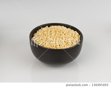Puffed millet isolated, crispy cereal breakfast, ancient healthy food Puffed millet isolated, crispy cereal breakfast, ancient healthy food 136995893