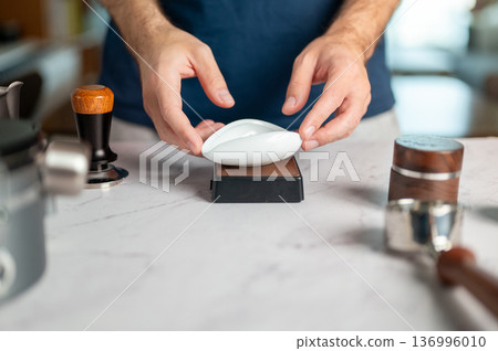 Man Using A Scale To Measure Coffee Beans For Espresso Preparation 136996010
