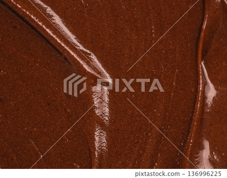 Chocolate spread texture with organic flowing lines background Chocolate spread texture with organic flowing lines background 136996225