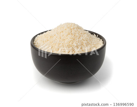 Grated coconut powder. Dry coco flakes pile, shredded desiccated coconut, tropical fruit chips 136996590