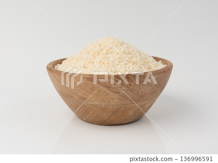 Grated coconut powder. Dry coco flakes pile, shredded desiccated coconut, tropical fruit chips 136996591