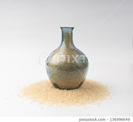 White parboiled rice grains. Dry uncooked ponni rice, small organic basmati White parboiled rice grains. Dry uncooked ponni rice, small organic basmati 136996649