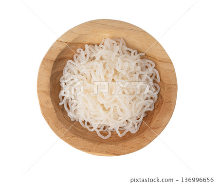 Shirataki or konnyaku pasta in wood bowl isolated. Konjak jelly noodles, Japanese zero calorie sirataki Shirataki or konnyaku pasta in wood bowl isolated. Konjak jelly noodles, Japanese zero calorie sirataki 136996656