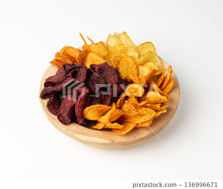 Parsnips, sweet potato, carrot and beetroot chips isolated, dry vegetable root mix, healthy snacks Parsnips, sweet potato, carrot and beetroot chips isolated, dry vegetable root mix, healthy snacks 136996671