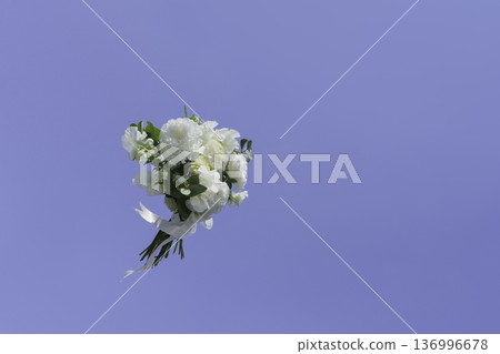 Wedding bouquet flying in the sky 136996678