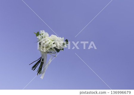 Wedding bouquet flying in the sky 136996679