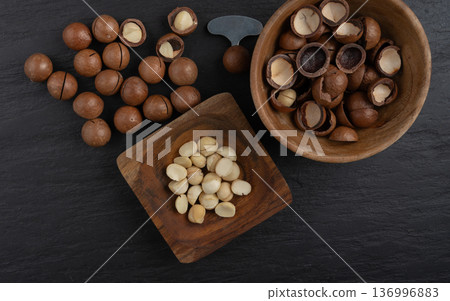 Macadamia nuts. Natural raw peeled macadamia seeds and shells Macadamia nuts. Natural raw peeled macadamia seeds and shells 136996883