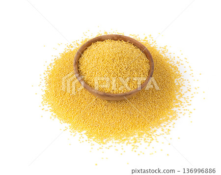 Raw millet grains pile isolated. Little yellow cereal, natural foxtail small seeds 136996886