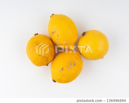 Old dried lemons. Fruits with darkened skins Old dried lemons. Fruits with darkened skins 136996894