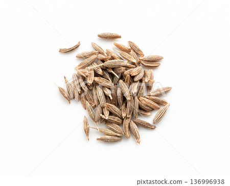 Cumin seed isolated. Caraway or fennel dry seeds close up, zeera macro, Indian cumin or zira grains Cumin seed isolated. Caraway or fennel dry seeds close up, zeera macro, Indian cumin or zira grains 136996938
